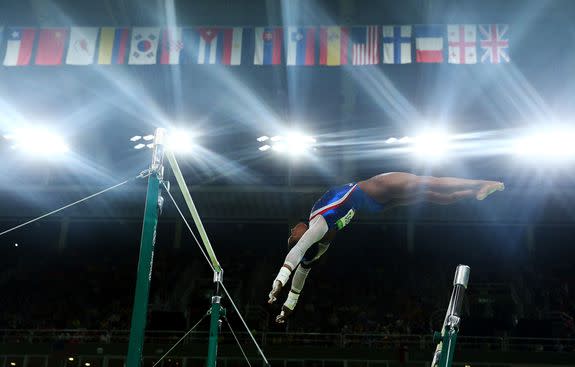 RIO DE JANEIRO, BRAZIL - AUGUST 11: Simone Biles of the United States competes on the uneven bars during the Women's Individual All Around Final on Day 6 of the 2016 Rio Olympics at Rio Olympic Arena on August 11, 2016 in Rio de Janeiro, Brazil. (Photo by Alex Livesey/Getty Images)