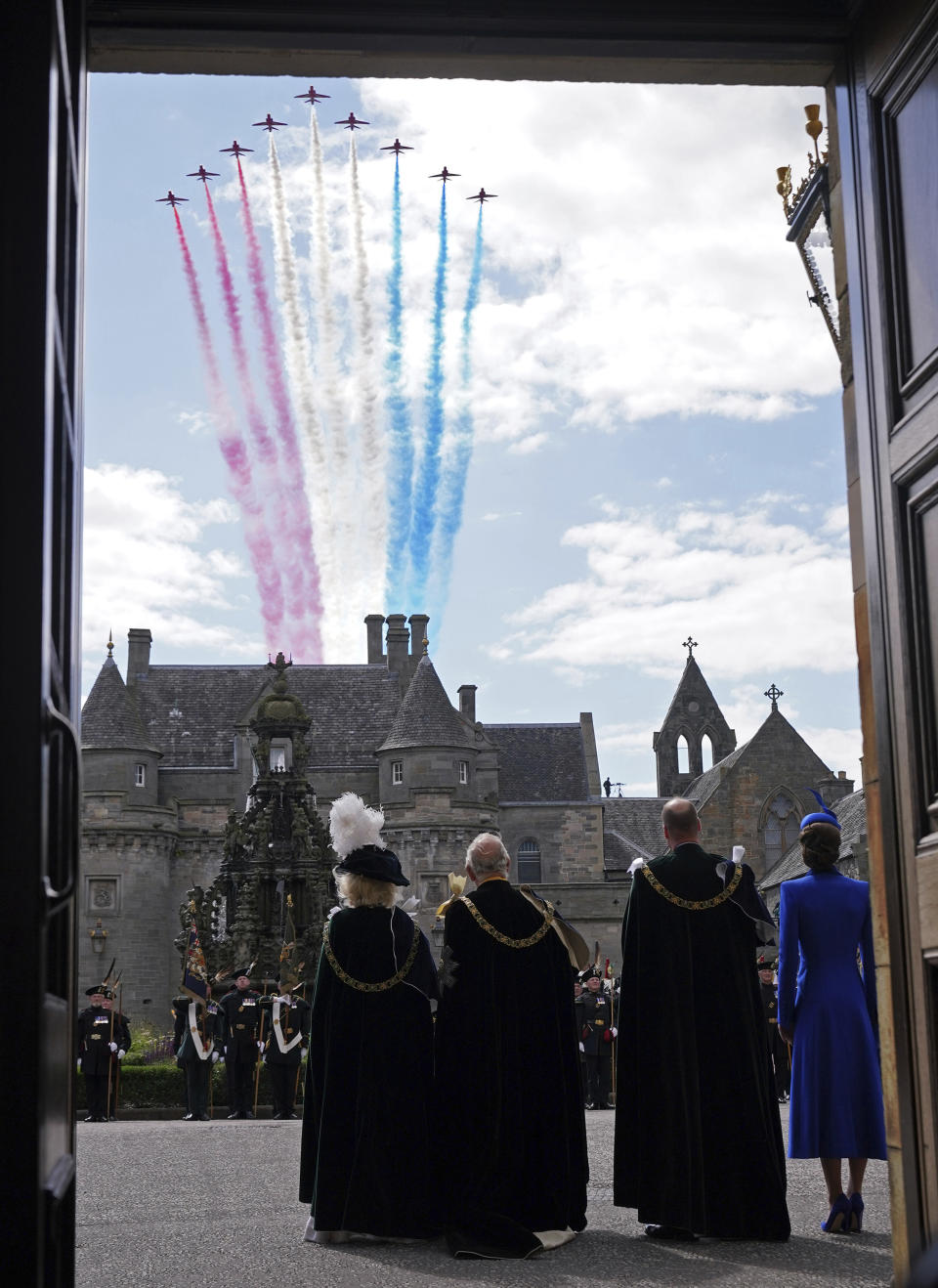 From left, Queen Camilla, Britain's King Charles III, Britain's Prince William and Kate, Princess of Wales, watch the Red Arrows flypast at the Palace of Holyroodhouse, after the National Service of Thanksgiving and Dedication for King Charles III and Queen Camilla, and the presentation of the Honours of Scotland, in Edinburgh, Wednesday July 5, 2023. Two months after the lavish coronation of King Charles III at Westminster Abbey in London, Scotland is set to host its own event to mark the new monarch’s accession to the throne. (Yui Mok/Pool Photo via AP)