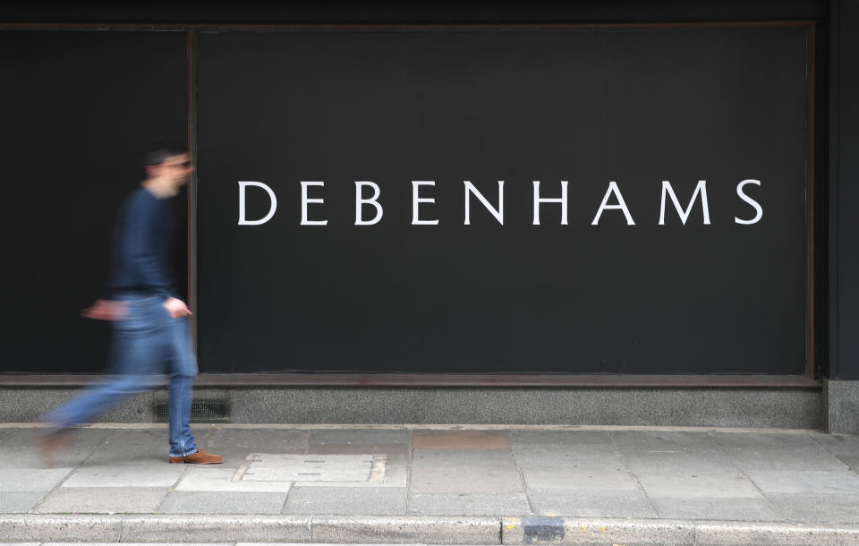 A person walks past a Debenhams department store in Southsea, Hampshire, which has been named as one of 22 stores to be closed, putting 1,200 jobs at risk across the department store chain. (Photo by Andrew Matthews/PA Images via Getty Images)
