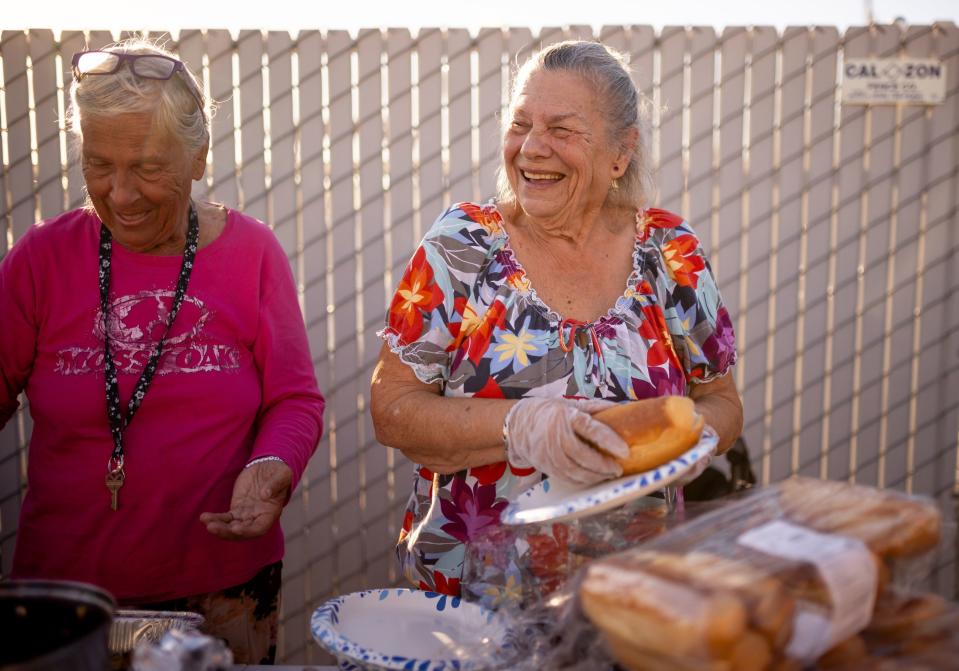 Norma Thornton laughs while she distributes a free meal to homeless people in Bullhead City, Ariz., on Tuesday, Oct. 24, 2023. | Spenser Heaps, Deseret News