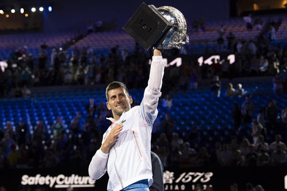 Novak Djokovic of Serbia poses with the Norman Brookes Challenge Cup after winning the Men's Singles Final match against Stefanos Tsitsipas of Greece