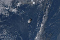 This satellite image taken by Himawari-8, a Japanese weather satellite operated by Japan Meteorological Agency and released by National Institute of Information and Communications Technology (NICT), shows an undersea volcano eruption at the Pacific nation of Tonga Saturday, Jan. 15, 2022. (NICT via AP)