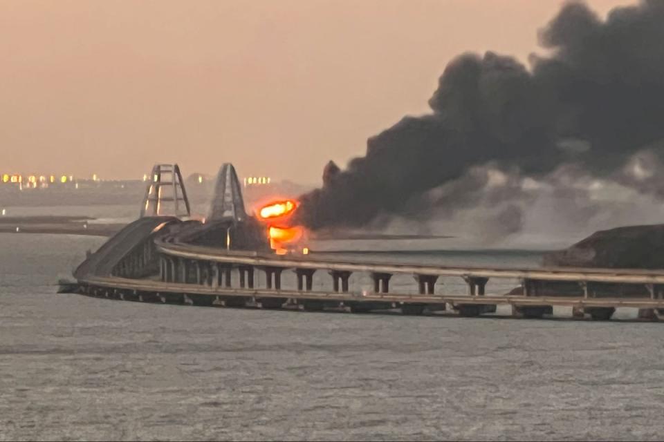 A view shows a fire on the Kerch bridge at sunrise in the Kerch Strait, Crimea (REUTERS)