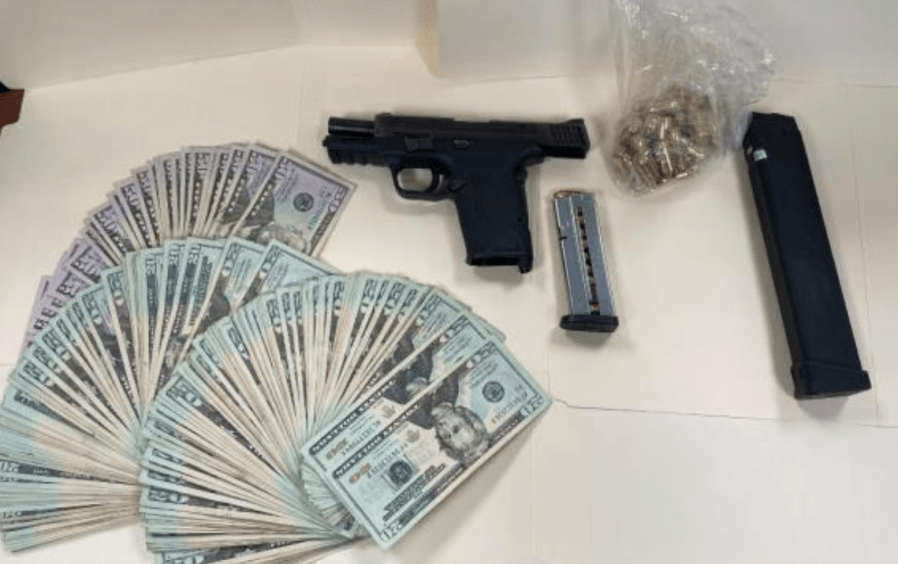 The LAPD supplied this photo of a gun, ammunition and cash they seized on Jan. 31, 2024.