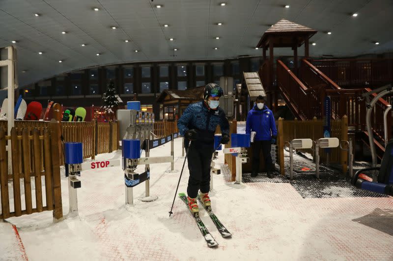 A man wearing a protective face mask gets ready to ski at Ski Dubai during the reopening of malls, following the outbreak of the coronavirus disease (COVID-19), at Mall of the Emirates in Dubai