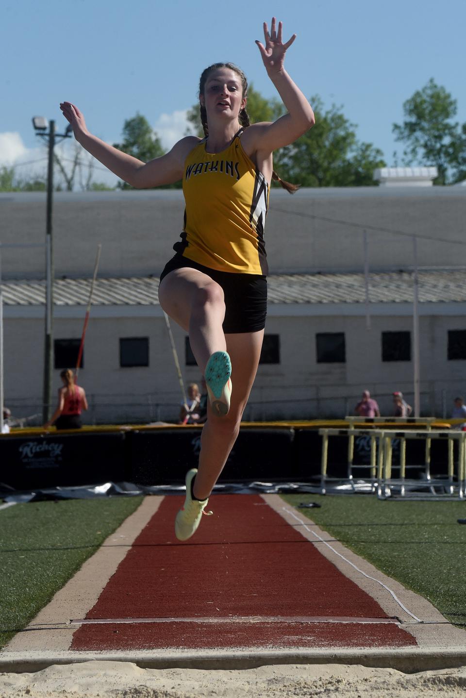 Watkins Memorial's Jenna Lucas competes in the Buckeye Division long jump during the second day of the Licking County League track meet Friday at Ascena Field. She leaped a personal best 17-7 to win the event.