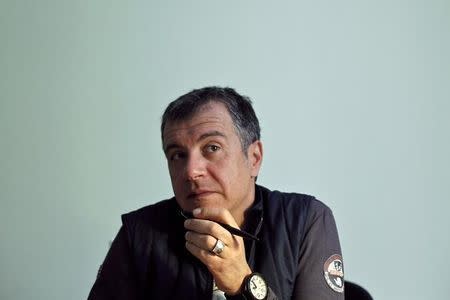 Founder of To Potami (The River) party Stavros Theodorakis listens to a question during an interview with Reuters in Athens, March 11, 2014. REUTERS/Alkis Konstantinidis