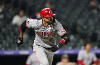 Cincinnati Reds' Nick Castellanos heads to first with an RBI double against the Colorado Rockies during the 12th inning of a baseball game Saturday, May 15, 2021, in Denver. The Reds won 6-5 in 12 innings. (AP Photo/David Zalubowski)