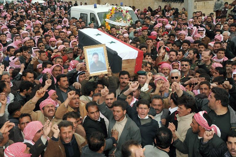 A handout picture released by the Syrian Arab News Agency (SANA) shows the funeral of Corporal Abdul Hai Ismail, in Aleppo on April 12, who was killed in Banias. Protests for greater freedoms spread Wednesday to Aleppo, Syria's second city, where hundreds of university students clashed with police and a smaller protest took place in the capital, rights activists told AFP by telephone