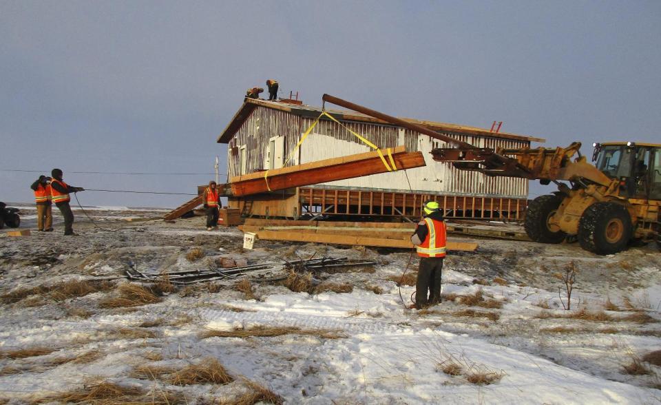 This Dec. 20, 2016 photo provided by Dale Smith shows an old slaughterhouse in Mekoryuk, Alaska, before it was demolished. The building is being replaced with a new slaughterhouse as part of a federally funded endeavor to expand the tribal government's commercial reindeer subsidiary with the herd that was introduced a century ago. (Dale Smith via AP)