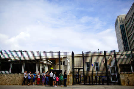 People wait for their turn to enter the U.S. Embassy in Havana, Cuba, January 12, 2018. REUTERS/Alexandre Meneghini