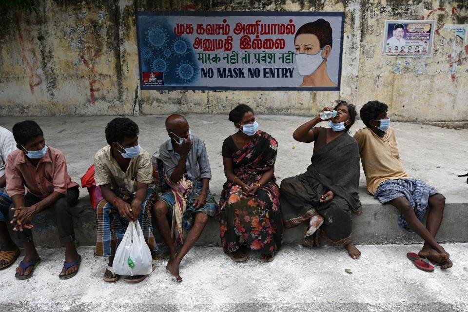 People wait to receive a meal lockdown Chennai