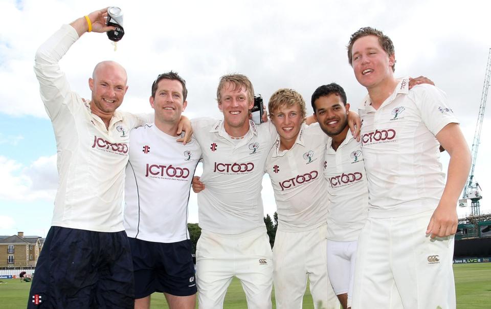 Yorkshire CCC players celebrate promotion back to Division One of the County Championship, including Joe Root (3rd from right) and Azeem Rafiq (2nd from right) Essex CCC vs Yorkshire CCC, Cricket, Ford County Ground, Chelmsford, Essex, UK. - Gavin Ellis/TGSPHOTO/Shutterstock