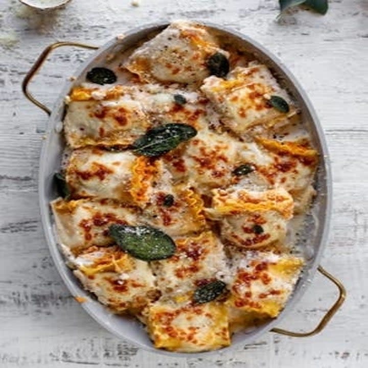 lasagna pumpkin roll ups baked in a baking dish