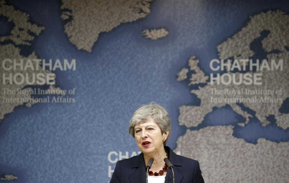 Britain's Prime Minister Theresa May speaks at Chatham House in London, Wednesday July 17, 2019. Prime Minister Theresa May says she worries about the increasing "absolutism" of world politics, in a message many will see as aimed at her successor as Britain's leader and President Donald Trump. (Henry Nicholls/Pool via AP)