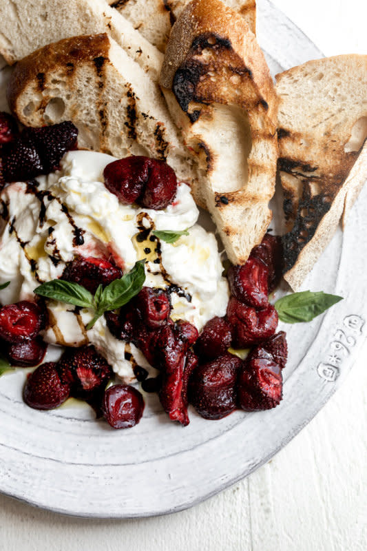 <p>Cooking with Cocktail Rings</p><p>Roasted strawberries are served over creamy burrata with a drizzle of balsamic glaze and olive oil paired with thick slices of grilled bread.</p><p><strong>Get the recipe: <a href="https://cookingwithcocktailrings.com/roasted-strawberries-with-burrata/" rel="nofollow noopener" target="_blank" data-ylk="slk:Roasted Strawberries with Burrata;elm:context_link;itc:0;sec:content-canvas" class="link rapid-noclick-resp"><em>Roasted Strawberries with Burrata</em></a></strong></p>