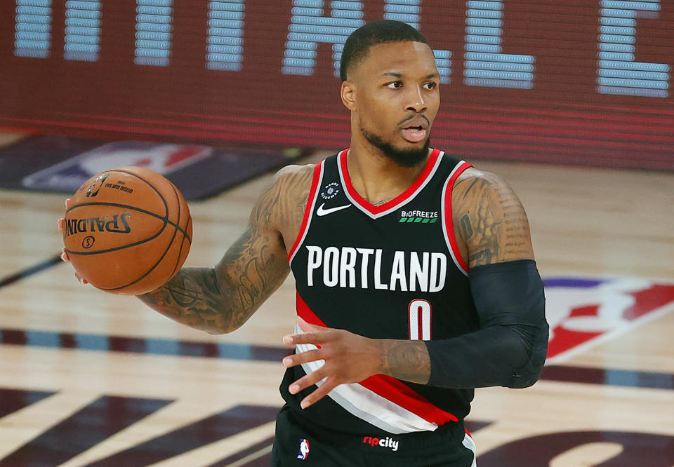 Portland Trail Blazers' Damian Lillard (0) dribbles during the second half of an NBA basketball game against the Houston Rockets Tuesday, Aug. 4, 2020, in Lake Buena Vista, Fla. (Kevin C. Cox/Pool Photo via AP)