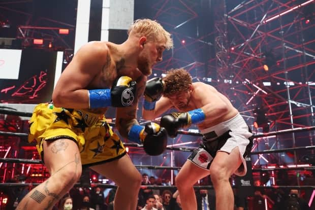 Jake Paul, left, fought Ben Askren in a novelty cruiserweight bout during Triller Fight Club in Atlanta on Saturday. Paul won via first-round TKO. (Al Bello/Getty Images for Triller - image credit)