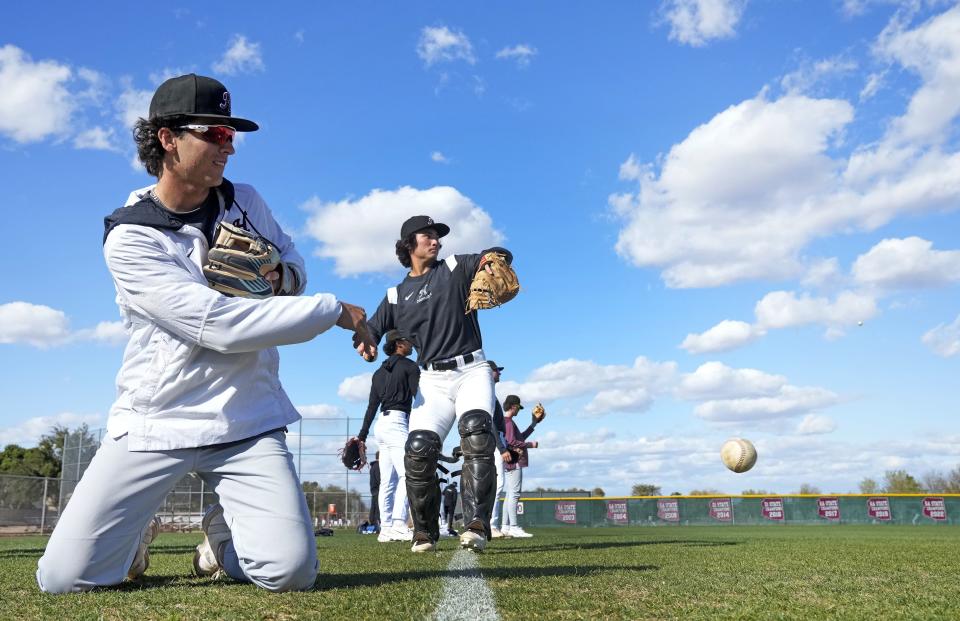 Hamilton infielder Roch Cholowsky throws a ball during practice in Chandler on Feb. 15, 2023.