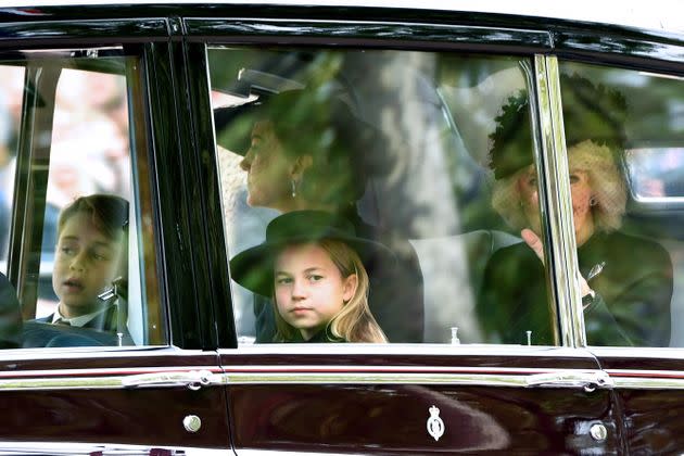 Prince George, Princess Charlotte, the Princess of Wales and Camilla, Queen consort, are seen on The Mall ahead of the state funeral. (Photo: ANTHONY DEVLIN via Getty Images)