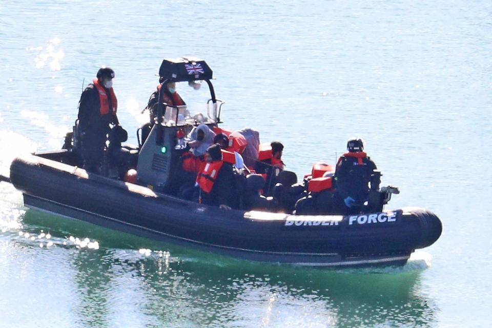A file photo of Border Force officers bringing to shore men thought to be migrants in Dover, Kent, after a number of small boat incidents in the English Channel (PA)
