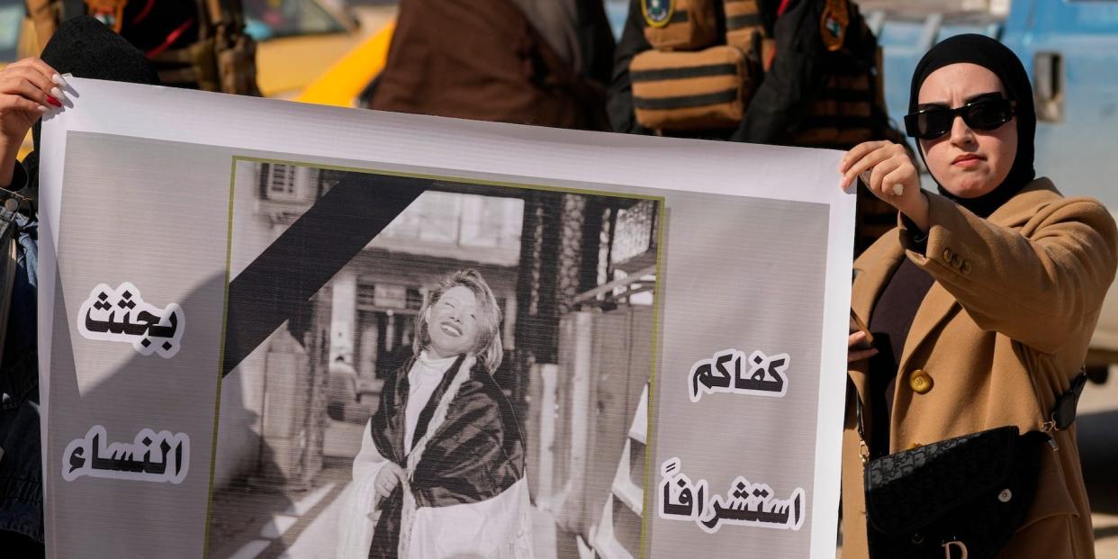 Demonstrators carry a poster with a picture of Tiba Ali, a YouTube star who was recently killed by her father, in Diwaniya, Iraq, Sunday, Feb. 5, 2023.
