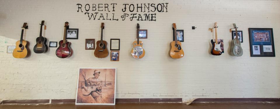 Guitars donated by artists who respect and play Blues legend Robert Johnson's music hang on the wall at the Robert Johnson Blues Museum in Crystal Springs on Monday, Feb. 3, 2020.