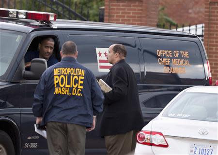 A van with the office of the Chief Medical Examiner leaves after a shooting at the Washington Navy Yard in Washington September 16, 2013. REUTERS/Joshua Roberts