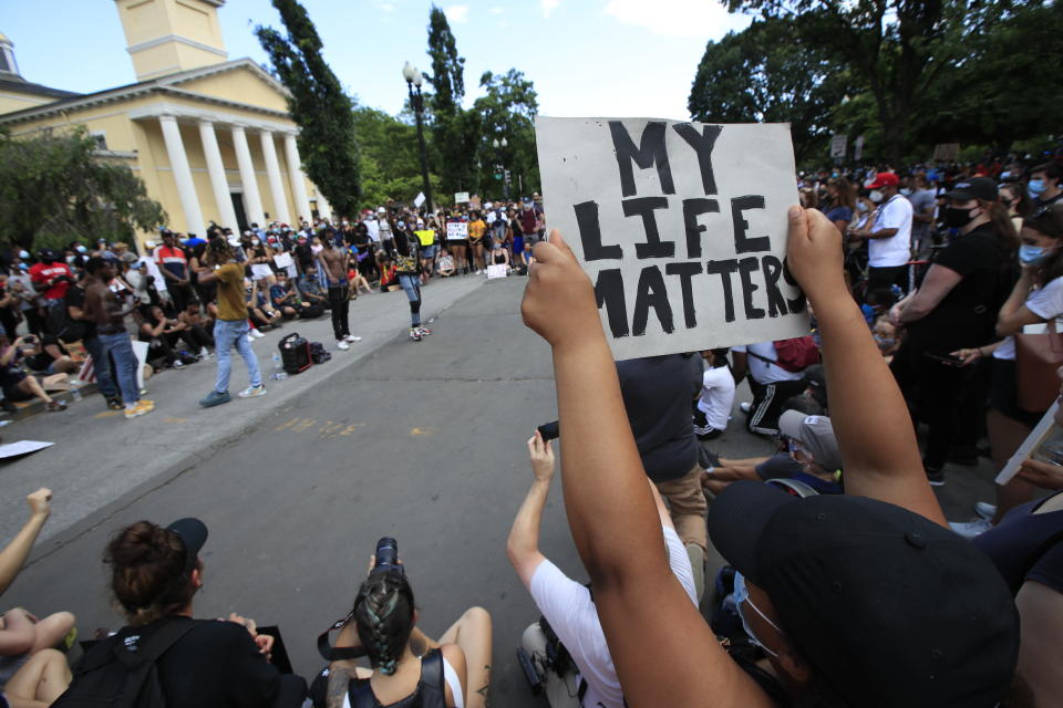 Demonstrators protest Friday, June 5, 2020, near the White House in Washington, over the death of George Floyd, a black man who was in police custody in Minneapolis. Floyd died after being restrained by Minneapolis police officers. (AP Photo/Manuel Balce Ceneta)