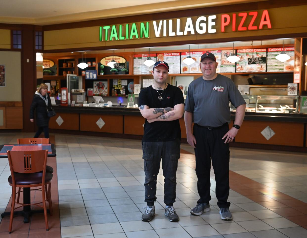 Italian Village Pizza Manager Nolan White, left, and owner Ryan Marquardt pose for a portrait Thursday, Feb. 1, 2024, in front of the pizza shop in the Lansing Mall.