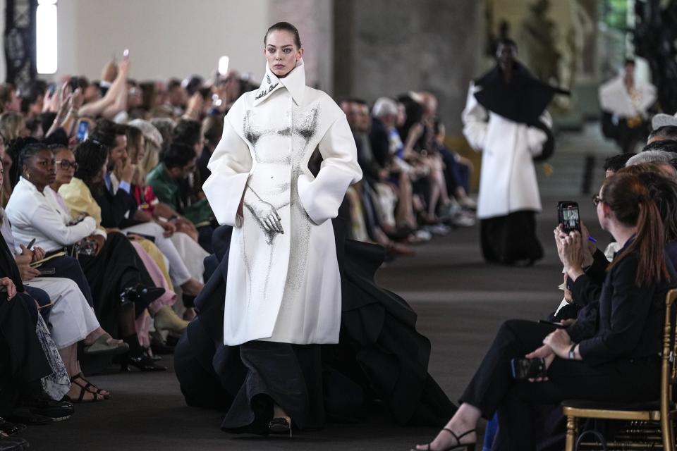 A model wears a creation for the Schiaparelli Haute Couture Fall/Winter 2023-2024 fashion collection presented in Paris, Monday, July 3, 2023. (AP Photo/Michel Euler)