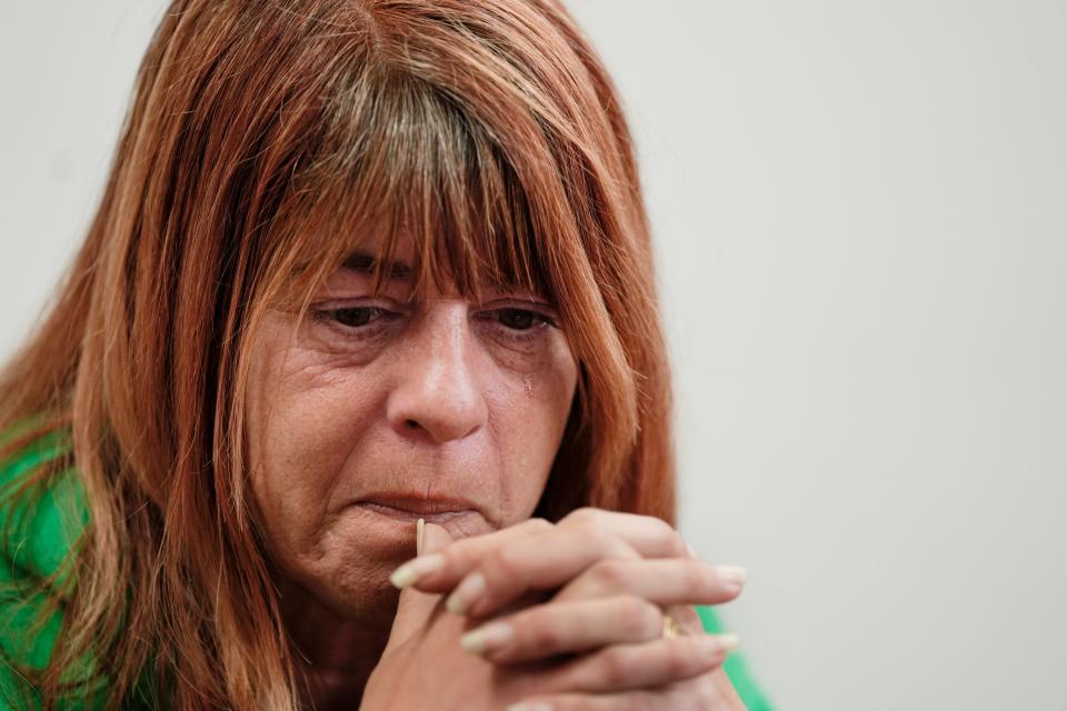 Krissy Ferguson, 49, cries as she talks about being dislocated along with her family when a train derailment forced residents of East Palestine from their homes on Feb. 3, 2023. Ferguson now lives in Columbiana and is full-time caretaker of her mom and stepdad, who have Parkinson’s and dementia respectively. Their rent is currently paid for by Norfolk Southern but the agreement is set to expire in May.