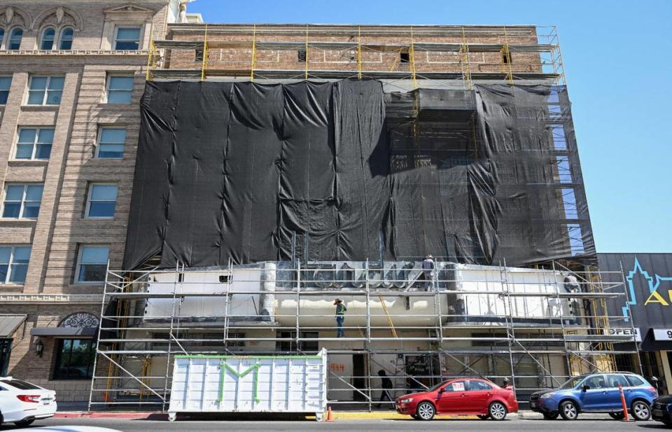 Scaffolding covers the front of the Hardy’s Theater building in downtown Fresno where work continues on the remodeling of the historic theater’s facade and sign on Tuesday, Sept. 19, 2023.