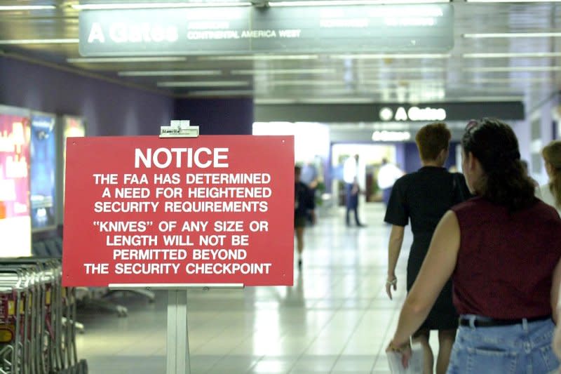 Airline passengers at Lambert-St. Louis International Airport are reminded about heightened security measures September 13, 2001, in the wake of the attacks in New York City and Washington, D.C. On September 13, U.S. carriers were allowed to resume flights and airports were under strict new security requirements in the wake of the 9/11 terrorist attacks. File Photo by Bill Greenblatt/UPI