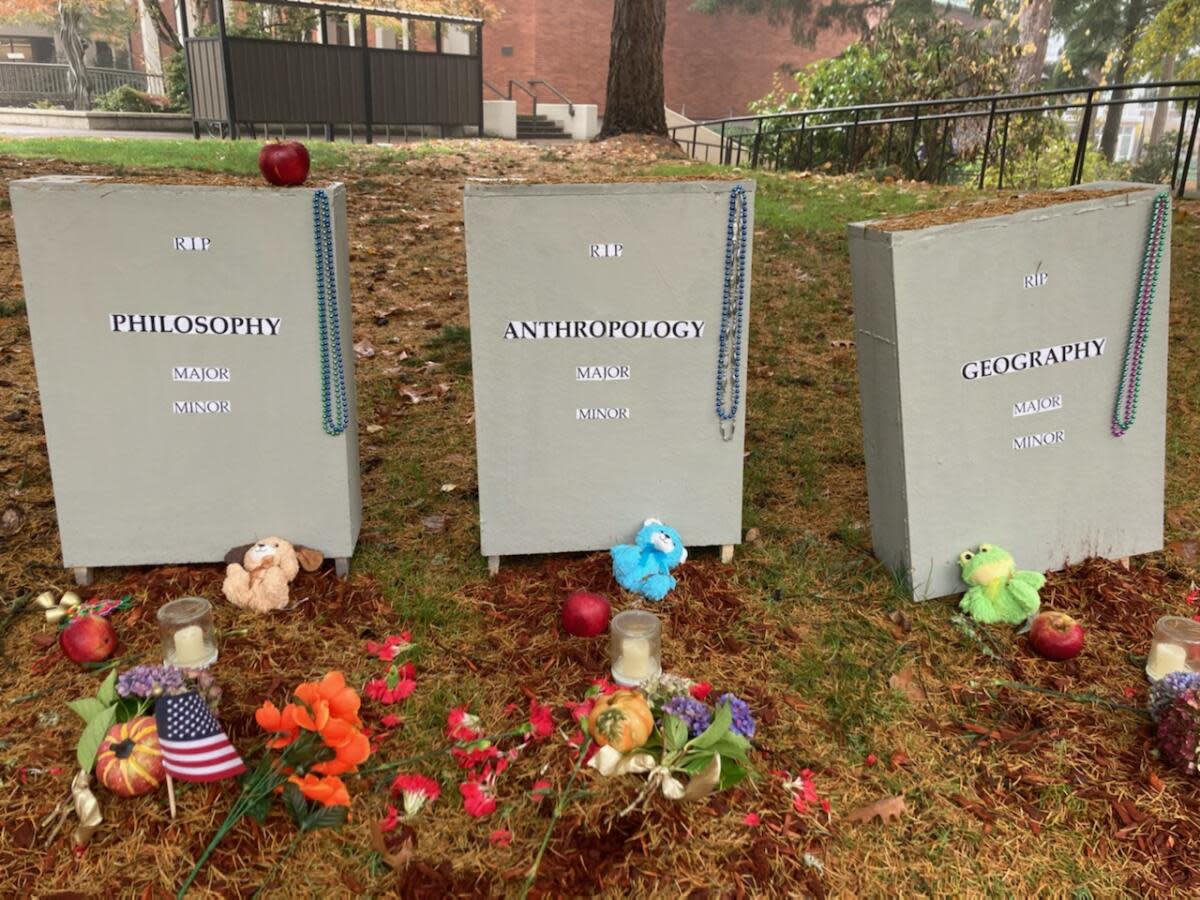 Three gravestone memorials appear outside Bellamy Hall at Western Oregon University over the weekend. The gravestones are meant to memorialize the termination of three traditional majors at Western, which were housed in Bellamy Hall.