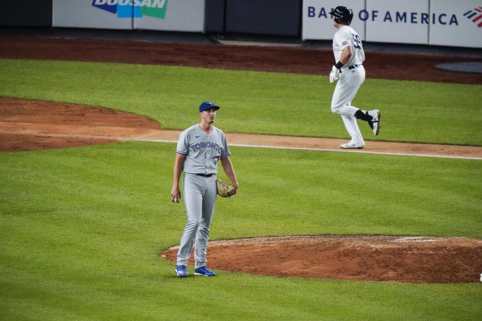 Toronto Blue Jays pitcher Jacob Waguespack waits as New York Yankees' Luke Voit, right, runs the bases after hitting a three-run home run during the sixth inning of a baseball game Wednesday, Sept. 16, 2020, in New York. (AP Photo/Frank Franklin II)