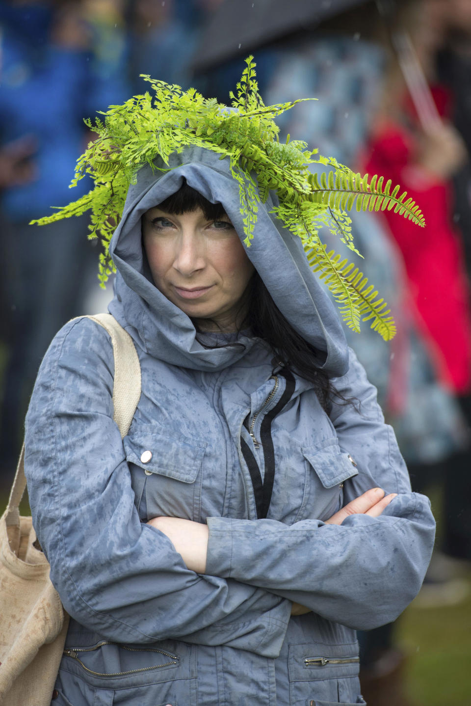A woman wears foliage during the People's Walk for Wildlife in central London, Saturday Sept. 22, 2018. Some hundreds of people gathered in London to demand better protection for the country’s wildlife, with many carrying banners in support of various pro-nature and pro-animal causes. (Dominic Lipinski/PA via AP)