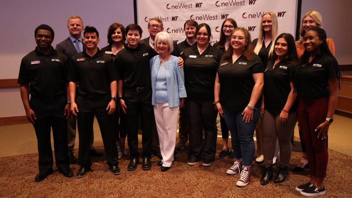 Dyke and Terry Rogers, center, pose with students in the Rogers LEAD WT program, along with advisers Dr. Rick Haasl, second from left, and Missy Macon, fourth from left.