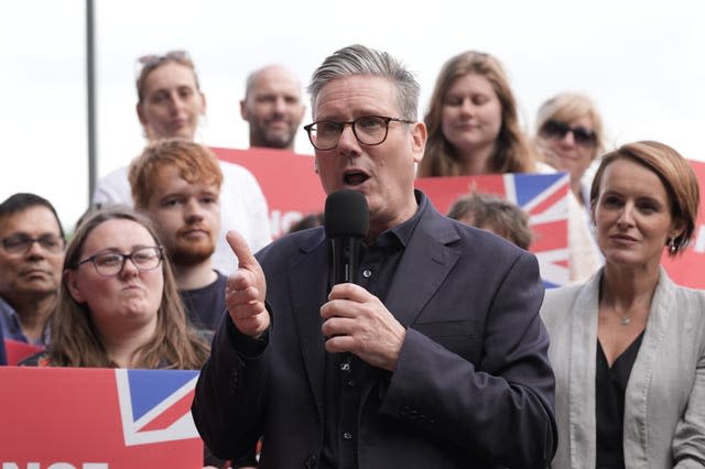 Sir Keir Starmer speaking with Labour supporters behind him