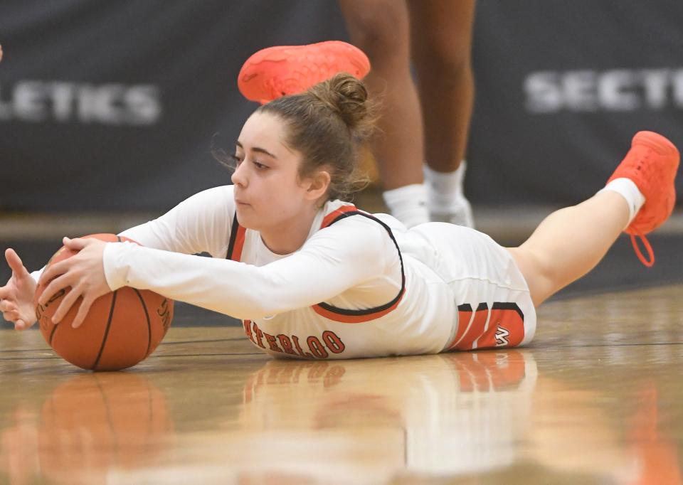 Morgan Caraballo of Waterloo dives on the floor for a loose ball during the Section V Class B1 finals against Palmyra-Macedon.