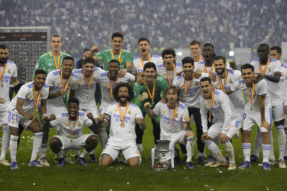 Real Madrid's players celebrate after winning the Spanish Super Cup final soccer match between Real Madrid and Athletic Bilbao at King Fahd stadium in Riyadh, Saudi Arabia, Sunday, Jan. 16, 2022. (AP Photo/Hassan Ammar)