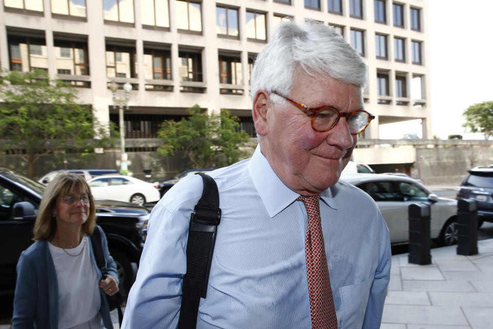 Greg Craig, former White House counsel to former President Barack Obama, walks into a federal courthouse for his trial, Thursday, Aug. 22, 2019, in Washington. (AP Photo/Patrick Semansky)