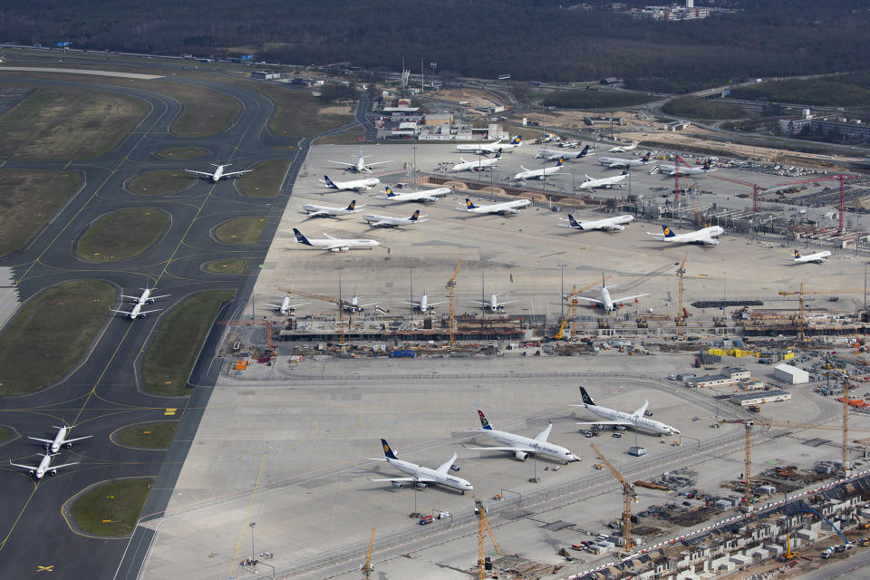 18 March 2020, Hessen, Frankfurt/Main: Next to the taxiways and taxiways of the airport are several Lufthansa aircraft. The planes have been parked because they are not in use at the moment. Like most other airlines, Lufthansa has drastically reduced the number of flights due to the coronavirus pandemic (picture repetition with better quality) Photo: Vasco Garcia/dpa (Photo by Vasco Garcia/picture alliance via Getty Images)