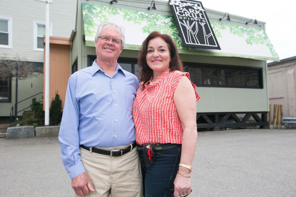 Eric and Nancy Pearson in front of Park Grill & Spirits in April of 2017.