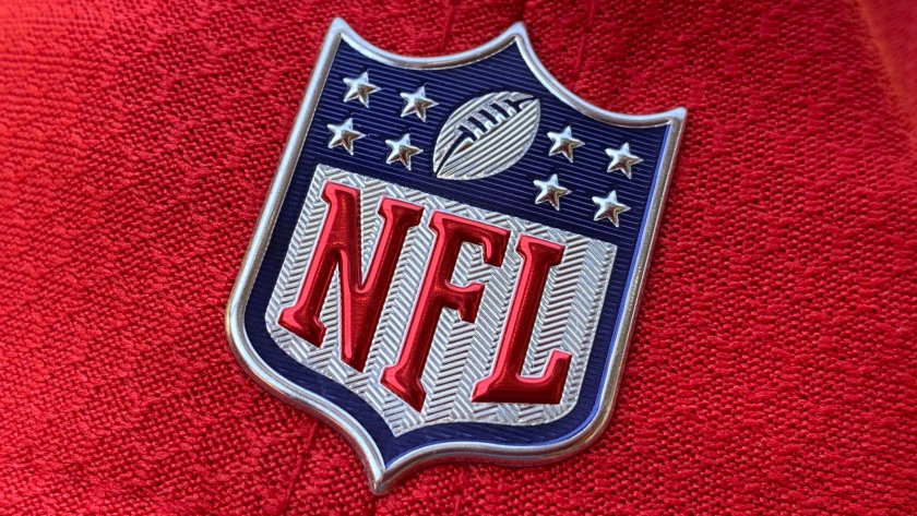 The official NFL logo is seen on the back of a hat.