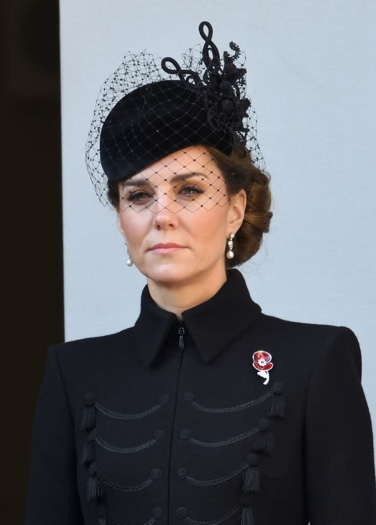 Kate Middleton wears a red poppy pin to honor her grandmother at Cenotaph memorial.