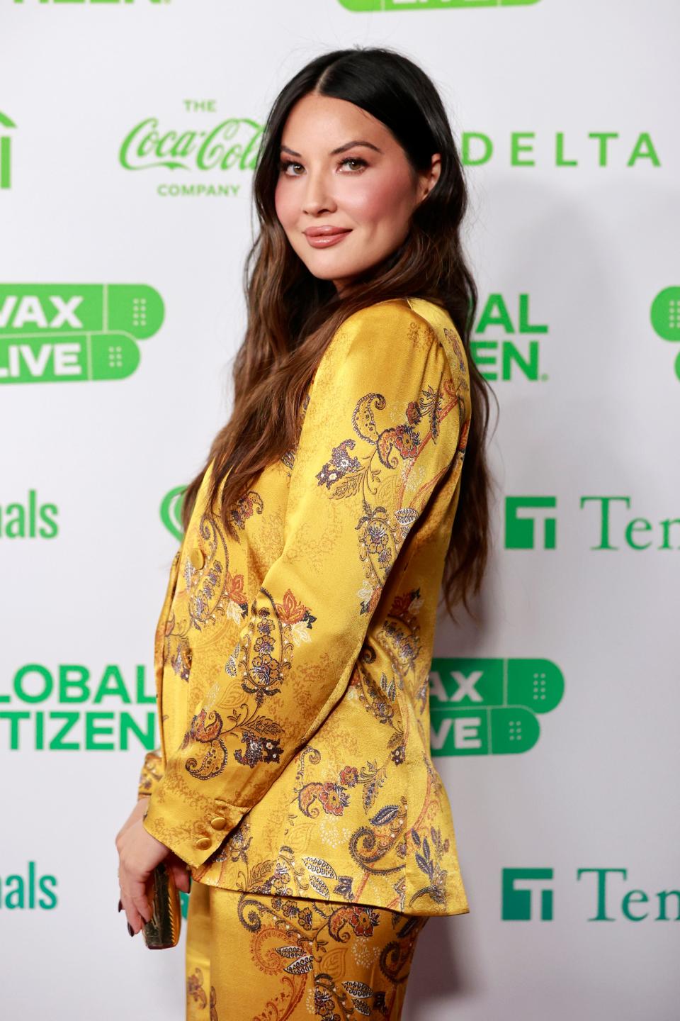 Olivia Munn attends Global Citizen VAX LIVE: The Concert To Reunite The World at SoFi Stadium in Inglewood, California in May of 2021.