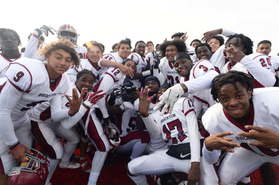 Brockton players celebrate after the Thanksgiving Day game against Bridgewater-Raynham on Thursday, Nov. 25, 2021.  Brockton won, 21-20, thanks to a late defensive stand.