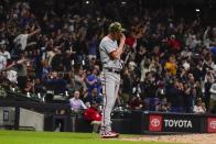 Washington Nationals starting pitcher Erick Fedde reacts after giving up a two-run home run to Milwaukee Brewers' Rowdy Tellez during the sixth inning of a baseball game Friday, May 20, 2022, in Milwaukee. (AP Photo/Morry Gash)