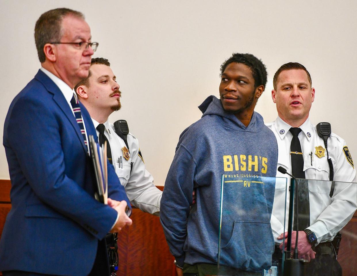 Dejan Belnavis is arraigned on murder charges in Central District Court Friday. He is wearing a sweatshirt with the name Bish's, a chain of RV dealerships.